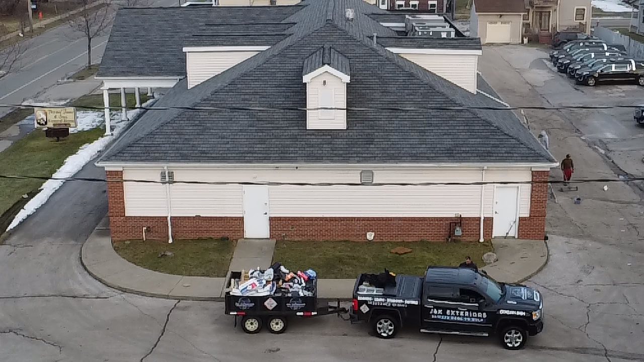 Storm and hail damage roof repair by J&K Exteriors near Canton, OH
