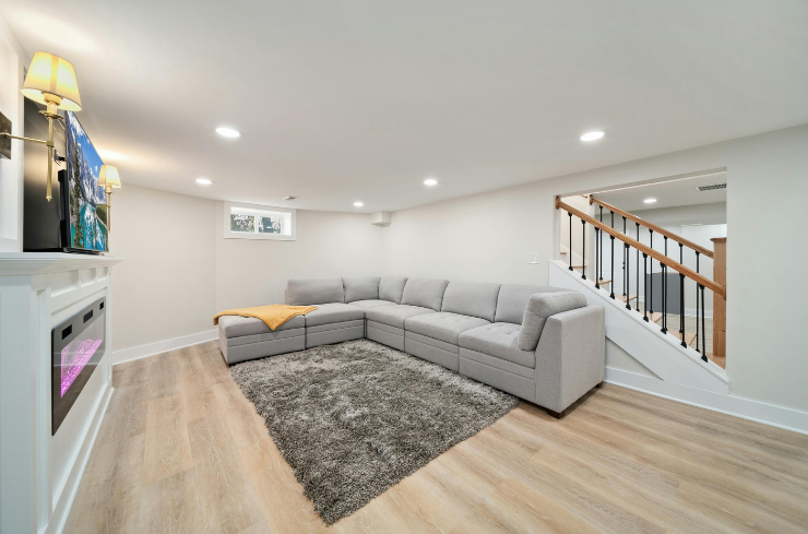 Finished basement with custom bar, butcher block countertop, and LVP flooring — basement remodeling services in Northeast Ohio by J&K Exteriors