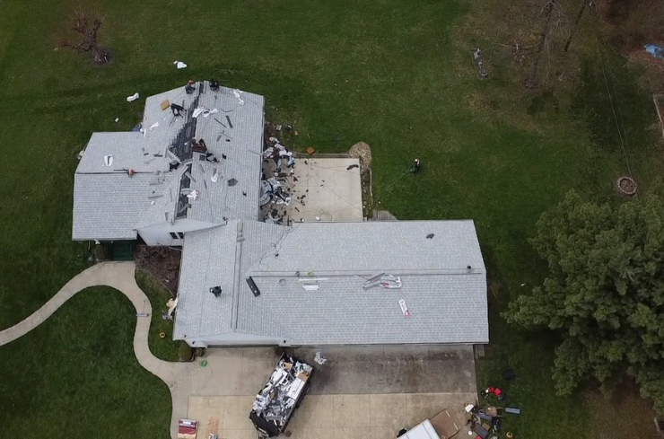 Roof inspection showing storm damage before repair on an Ohio home
