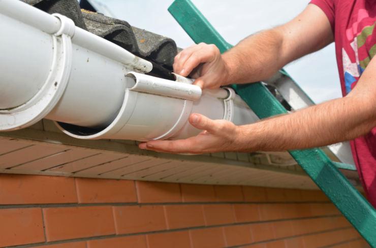 Home exterior before storm damage gutter repair