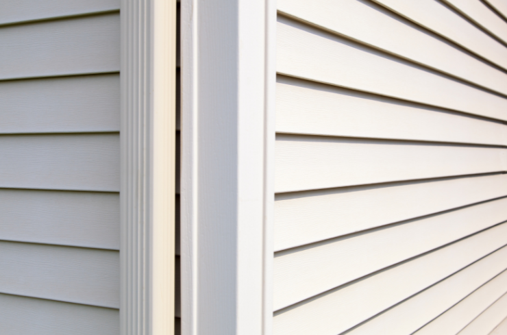 Home exterior after new insulated vinyl siding installation
