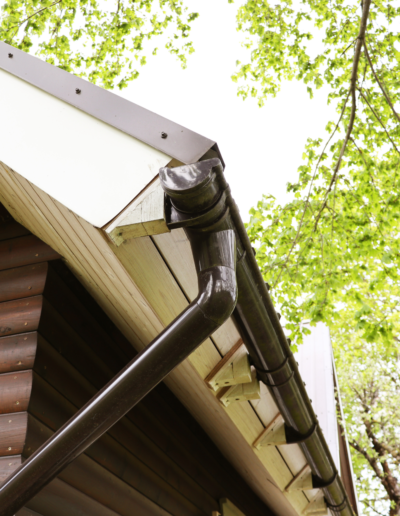 New gutters and downspouts installed alongside siding repair on Ohio home