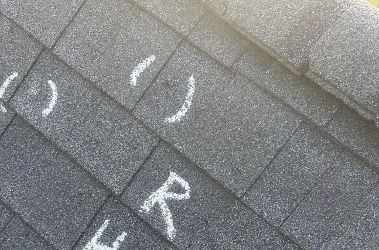 Roof showing hail damage before insurance inspection