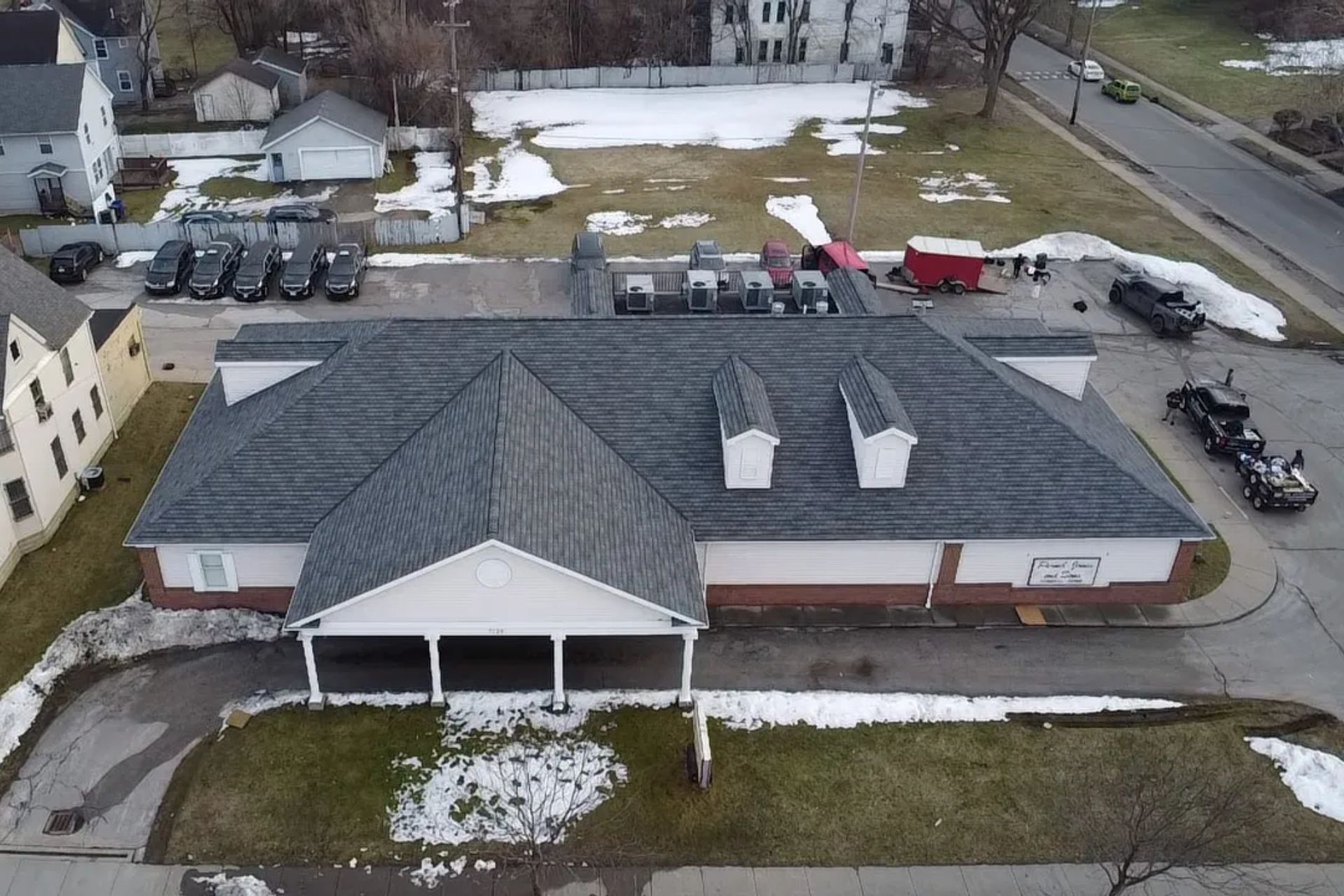 Completed shingle roof repair on a home near Akron, OH — aerial view
